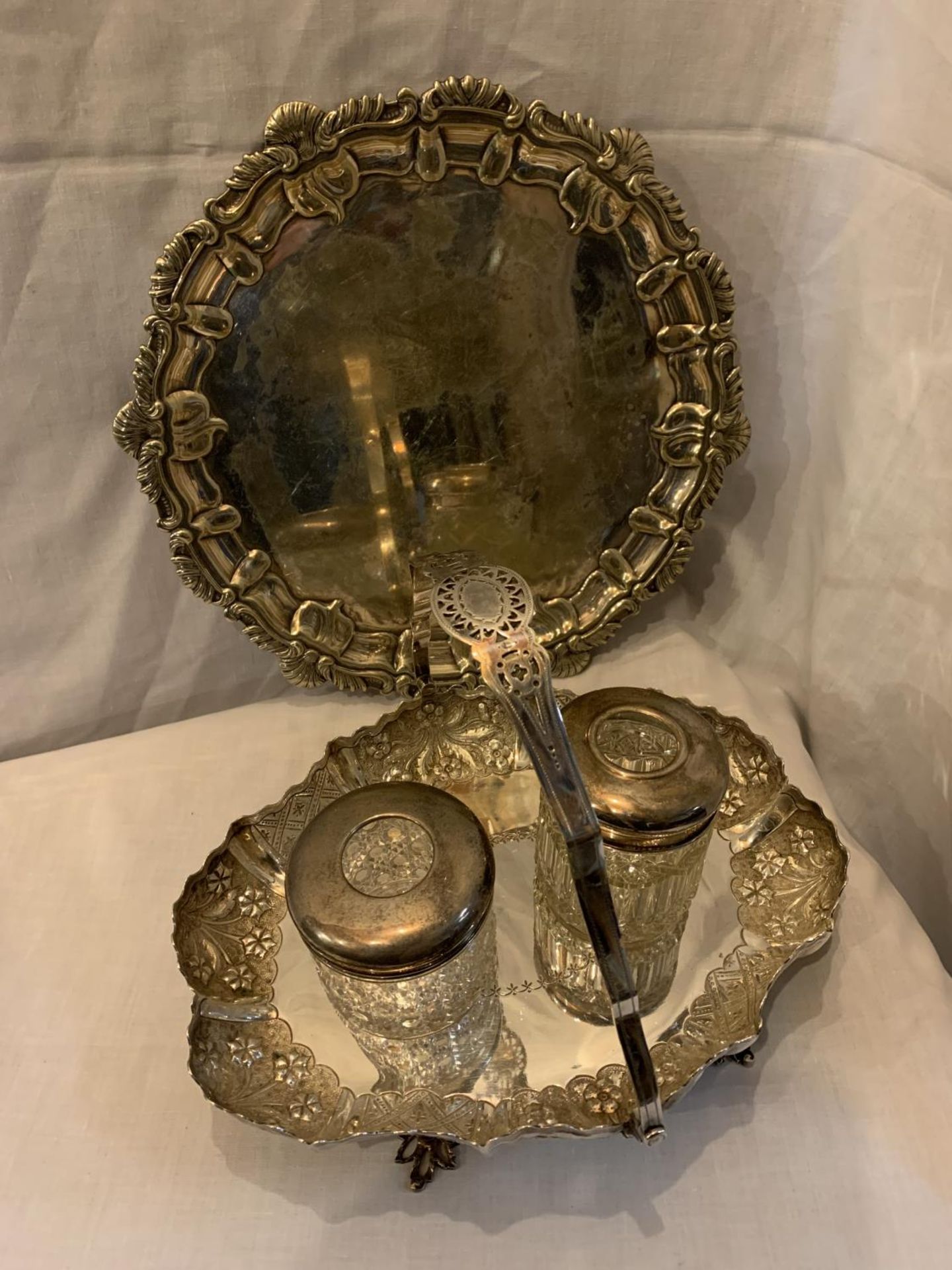 FOUR SILVER PLATE ITEMS TO INCLUDE A TRAY, BASKET AND TWO GLASS JAR WITH LIDS