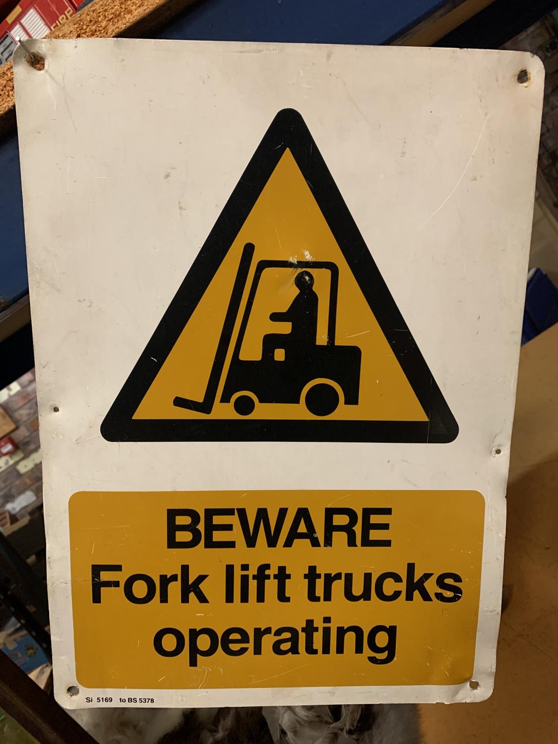 A TIN BEWARE FORK LIFT TRUCKS OPERATING SIGN