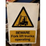 A TIN BEWARE FORK LIFT TRUCKS OPERATING SIGN