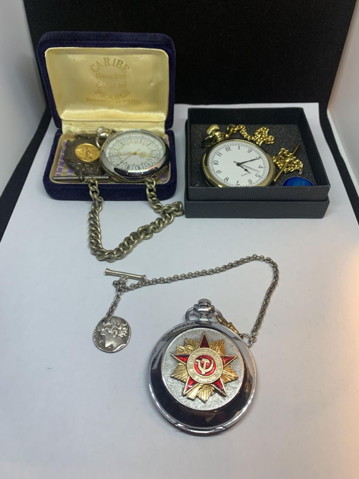 THREE VARIOUS POCKETS WATCHES - ONE WITH CHAIN AND FOOTBALL MEDAL FOB, ONE WITH CHAIN AND ST