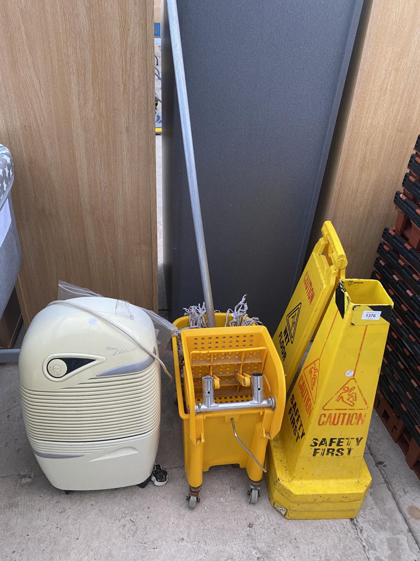 AN ASSORTMENT OF ITEMS TO INCLUDE WET FLOOR SIGNS, A MOP AND BUCKET AND A HEATER ETC