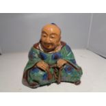 A TEA CADDY IN THE FORM OF A CHINA MAN, MARKED UNDERNEATH