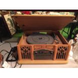 A VINTAGE STYLE MODERN CASED RECORD PLAYER INCORPORATING A CD AND A RADIO