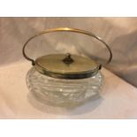 A LIDDED CUT GLASS BOWL/ BISCUIT BARREL, MARKED OX WMF EP NS I/O. HEIGHT 13CM, WIDTH 24CM