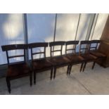 A SET OF SIX VICTORIAN BAR BACK DINING CHAIRS ON TURNED FRONT LEGS