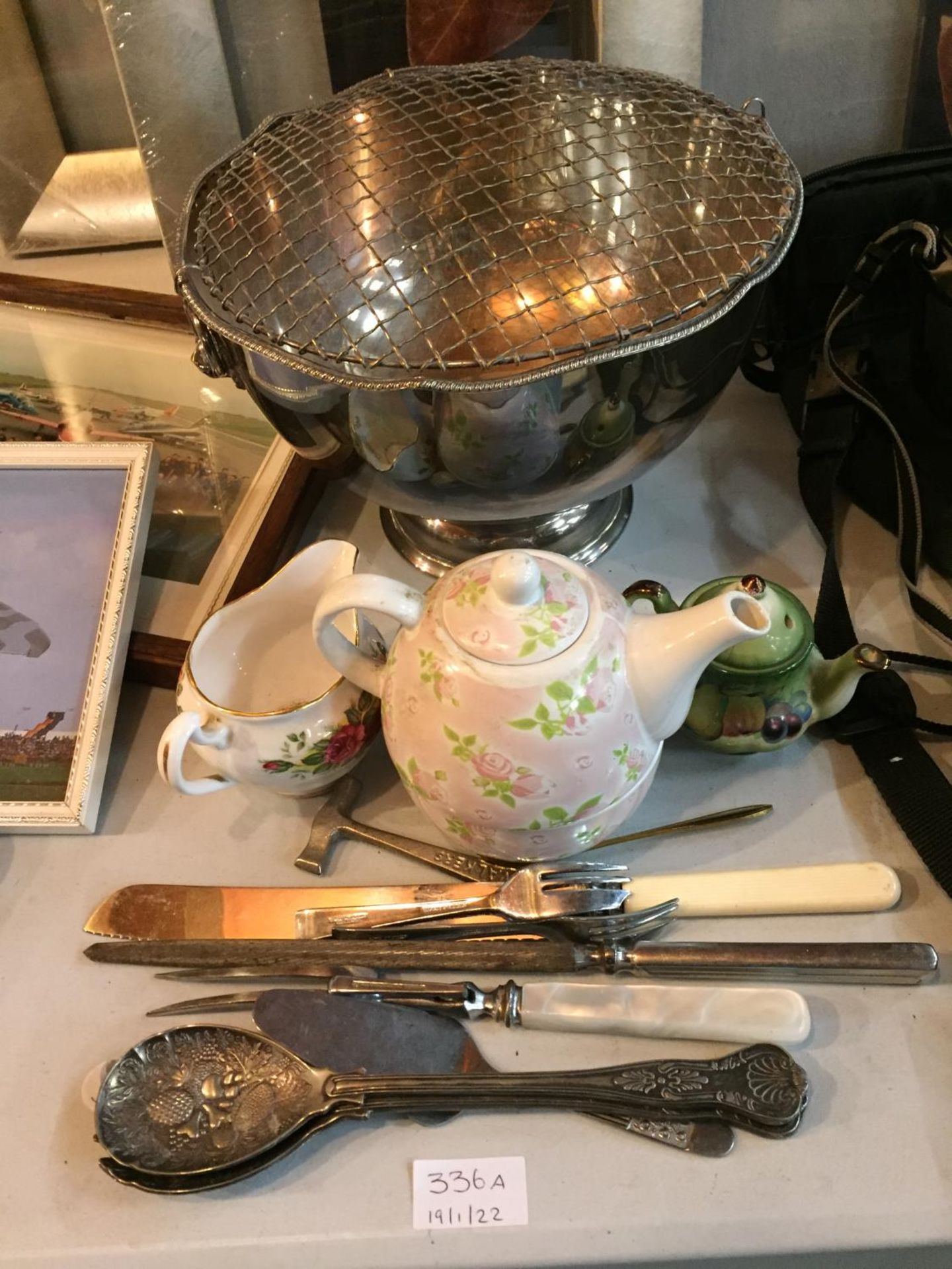 A LARGE SILVER PLATE ROSE BOWL, A TEA FOR ONE TEAPOT, SERVING SPOON AND FORK WITH FRUIT