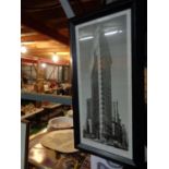 A FRAMED PICTURE OF THE FLATIRON BUILDING NEW YORK