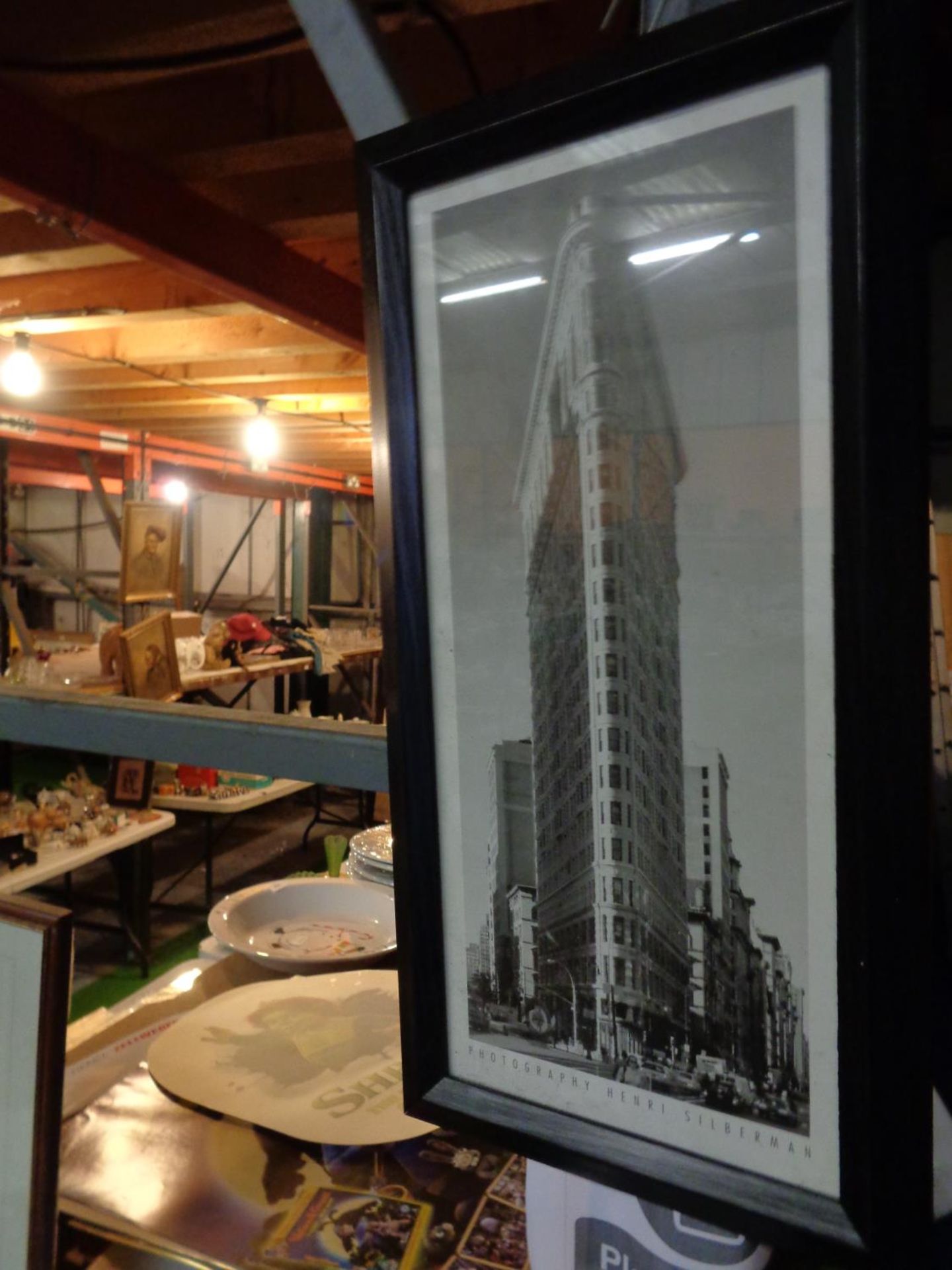 A FRAMED PICTURE OF THE FLATIRON BUILDING NEW YORK