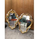 A PAIR OF DECORATIVE GILT FRAMED WALL MIRRORS