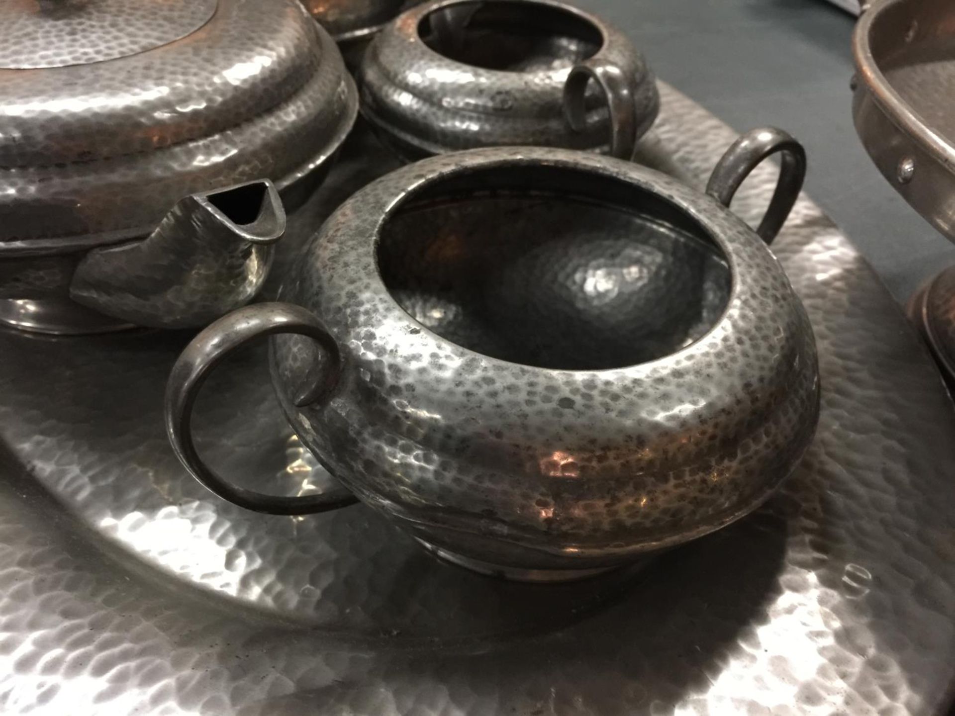 A PEWTER TEASET ON A TRAY, A PLATE ON A STAND AND THREE SMALLER PLATES - Image 6 of 6