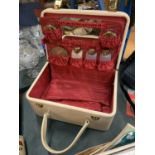 A LADIES TRAVEL VANITY CASE WITH STORAGE BOTTLES