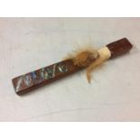 A TRIBAL STYLE STICK DECORATED WITH MOTHER OF PEARL LENGTH 25CM