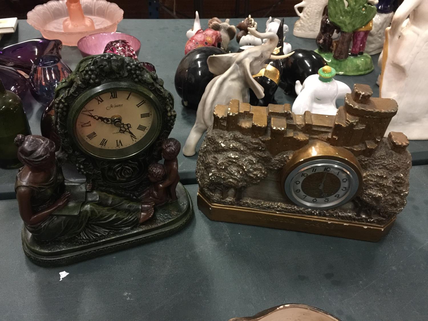 TWO MANTLE CLOCKS TO INCLUDE 'WINDSOR CASTLE,' AND A JULANA BATTERY OPERATED ONE WITH A LADY AND