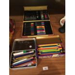 A QUANTITY OF COLOURED PENCILS, PENS, PASTELS, ETC IN TINS AND A BOXED STATIONERY SET