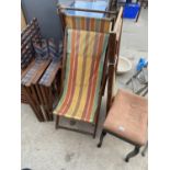 A VINTAGE PIANO STOOL, THREE VINTAGE FOLDING DECK CHAIRS AND TWO DIRECTORS CHAIRS