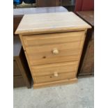 A MODERN PINE TWO DRAWER FILING CABINET