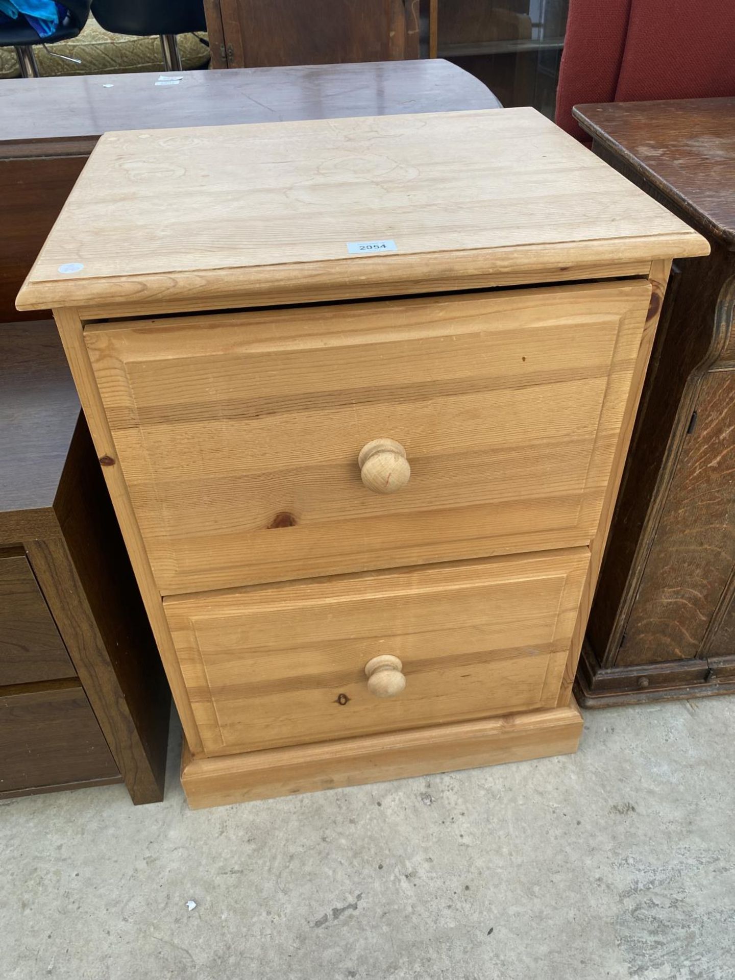 A MODERN PINE TWO DRAWER FILING CABINET