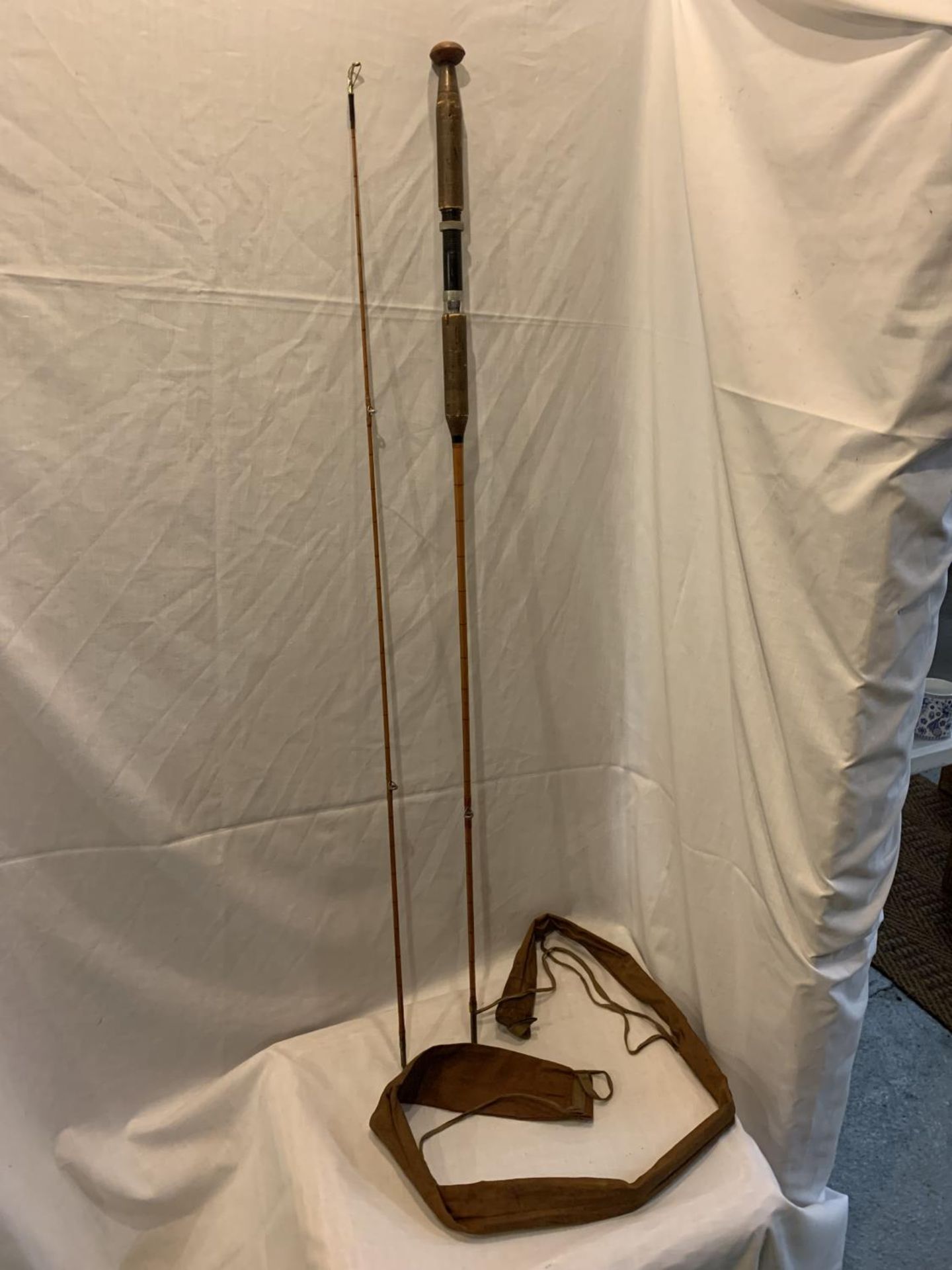 A VINTAGE 'A.W. GAMAGE LTD' LONDON SPLIT FLY CANE FISHING ROD IN ORIGINAL BAG