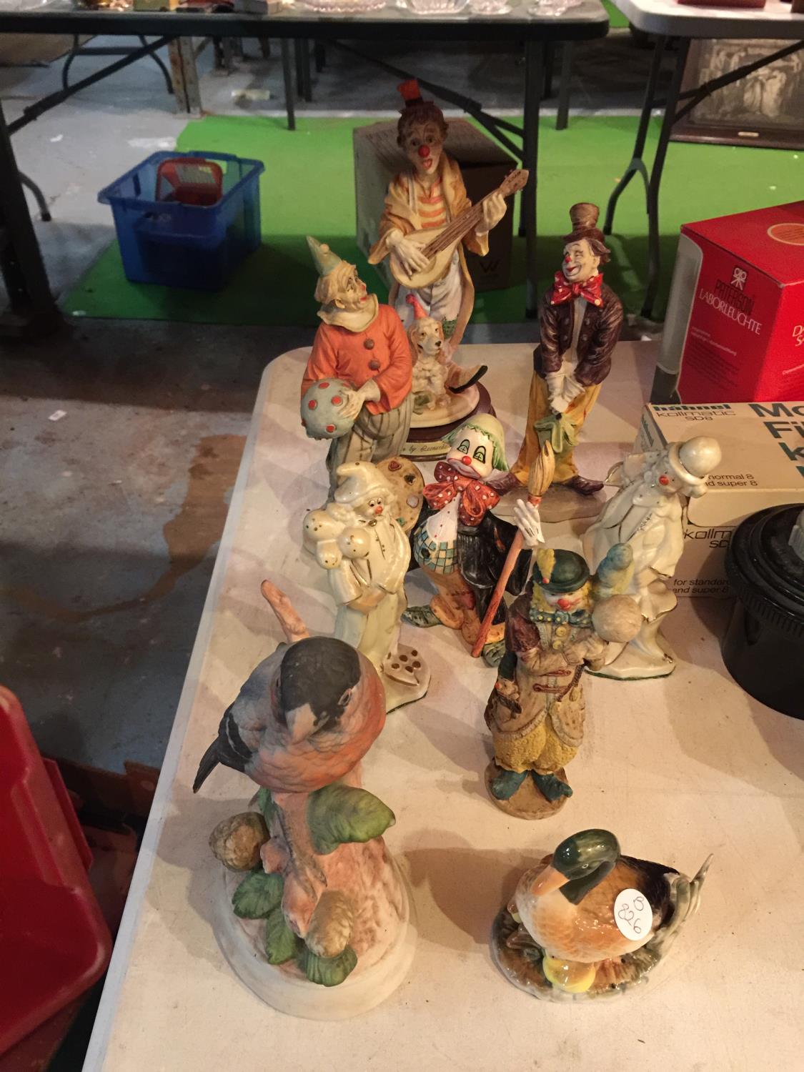 SEVEN CERAMIC FIGURES OF CLOWNS AND TWO BIRDS