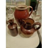 THREE STONEWARE JUGS TO INCLUDE A DOULTON LAMBETH EXAMPLE