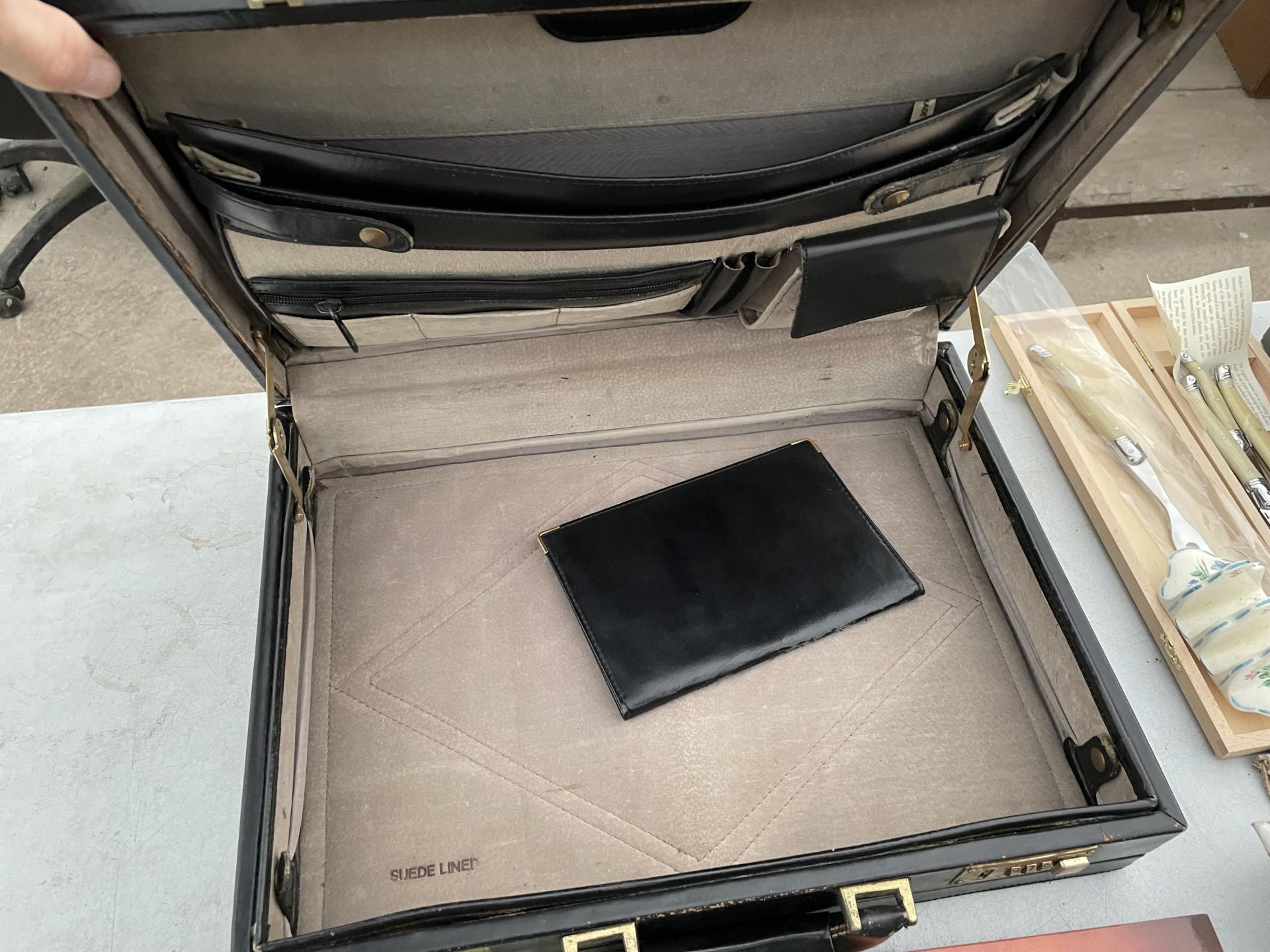 A LOCKABLE BRIEFCASE AND VARIOUS CAR MANUALS - Image 2 of 2