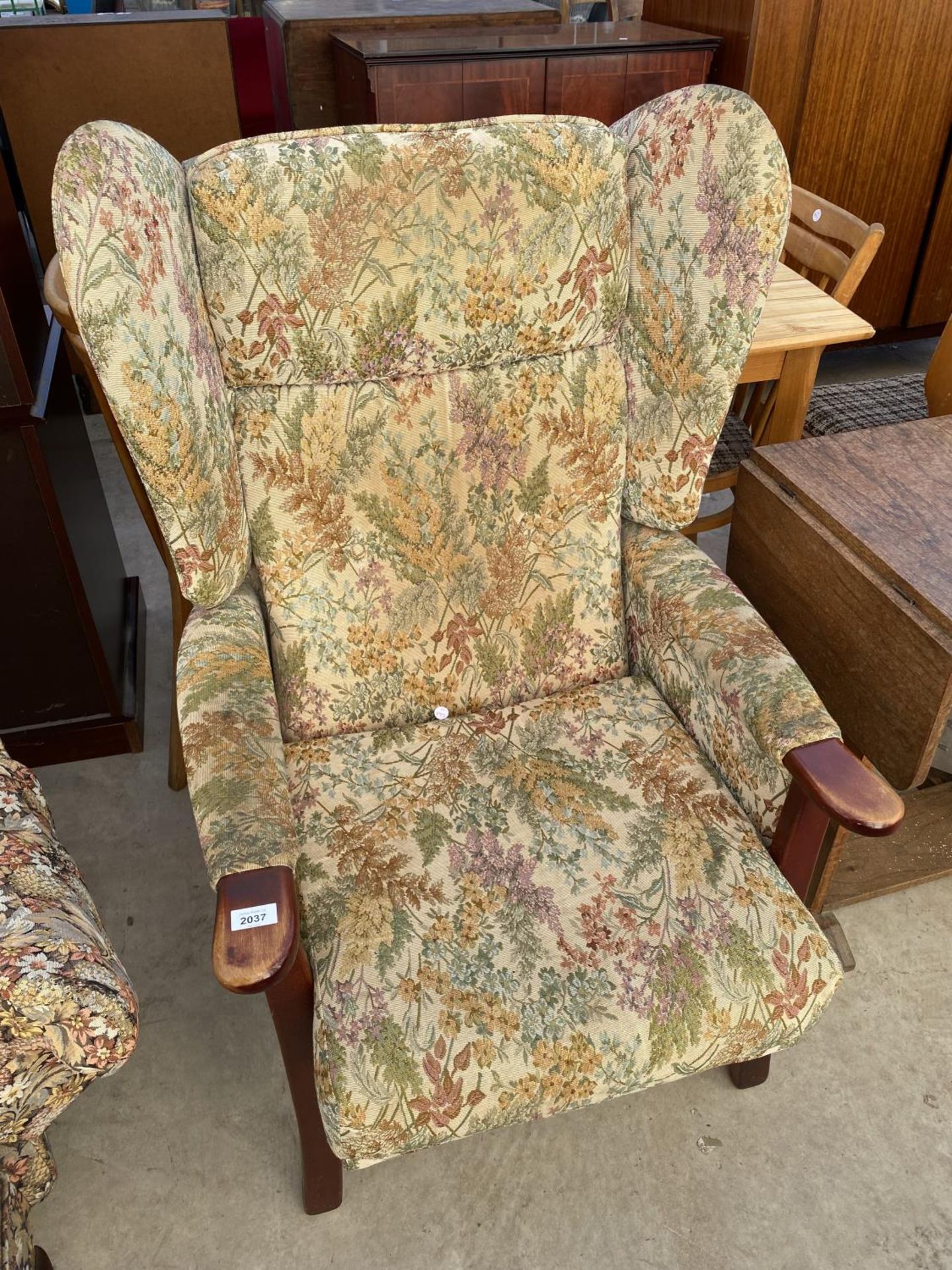 A WINGED PARKER KNOLL STYLE FIRESIDE CHAIR