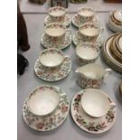 SIX MINTON HADDON HALL CUPS AND SAUCERS PLUS A SUGAR BOWL AND CREAM JUG