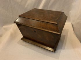 A VINTAGE MAHOGANY TEA CADDY WITH INTERIOR HINGED LIDDED BOXES MADE WITH SMALL DOVETAIL JOINTS (