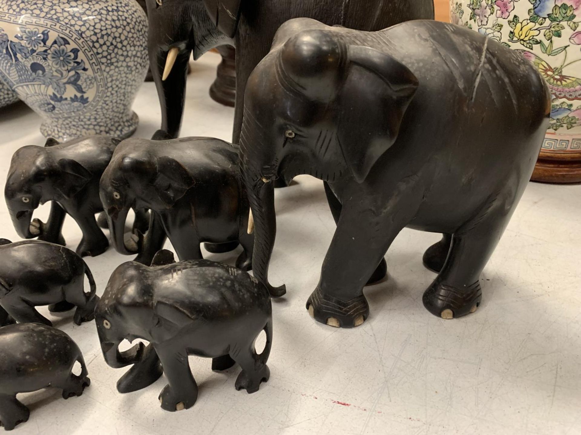 A COLLECTION OF VARIOUS SIZED EBONY ELEPHANTS - Image 2 of 4