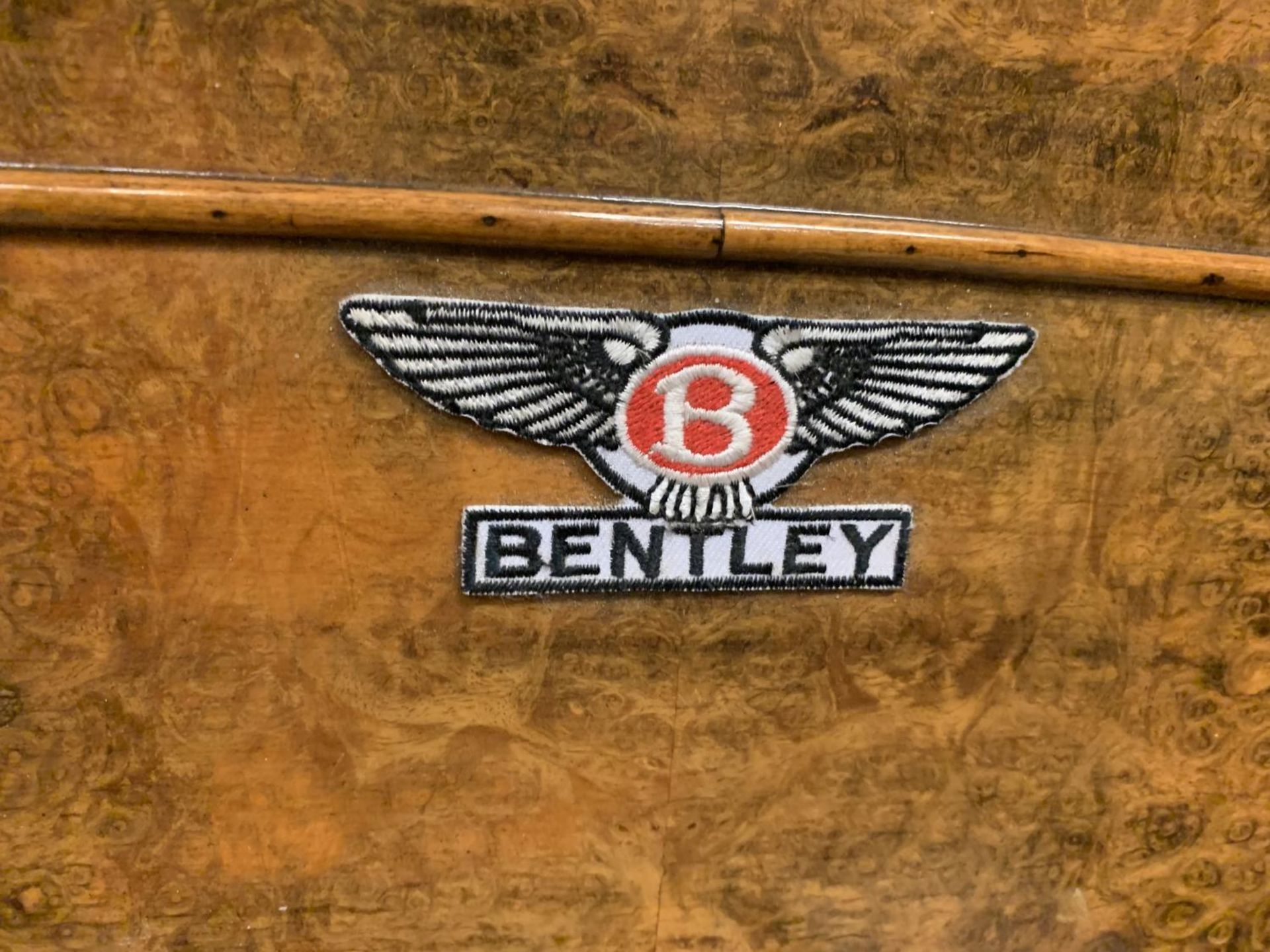 A CUSTOM MADE WALNUT DOG BED WITH A BENTLEY EMBLEM TOGETHER WITH A BENTLEY KEY FOB, - Image 6 of 6