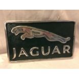 A CHROME AND RACING GREEN JAGUAR CAST SIGN