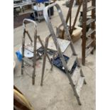 A THREE RUNG ALLUMINIUM STEP LADDER AND A FURTHER TWO RUNG STEP LADDER