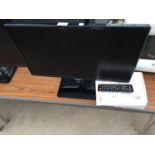 A 24" SAMSUNG TELEVISION WITH REMOTE CONTROL