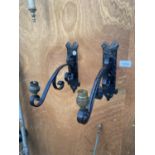 A PAIR OF WALL MOUNTED WROUGHT IRON LIGHT FITTINGS