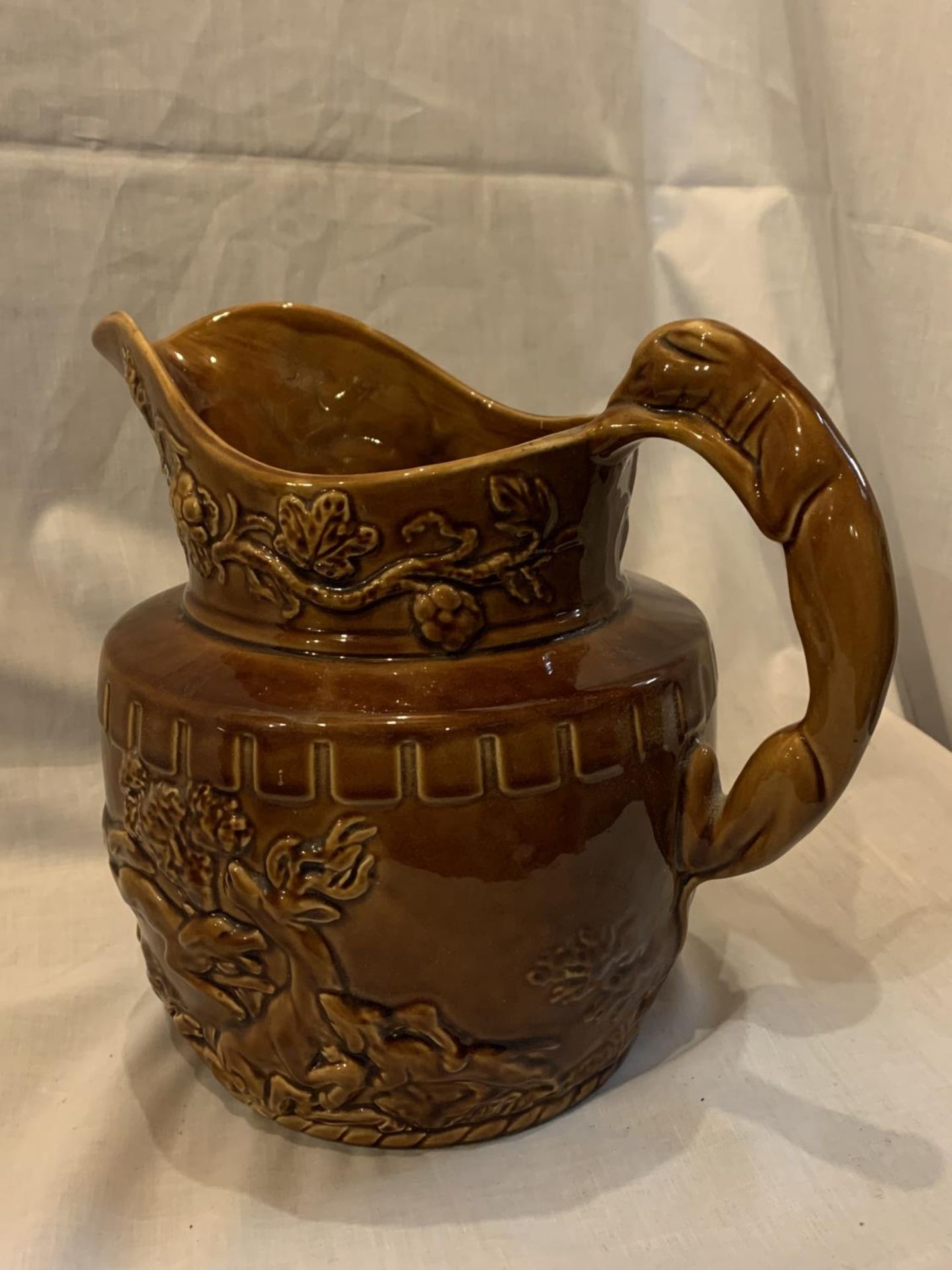 A WOOD LARGE TREACLE GLAZE JUG WITH BEAR AND HUNTING DECORATION AND A HOUND HANDLE - Image 3 of 5