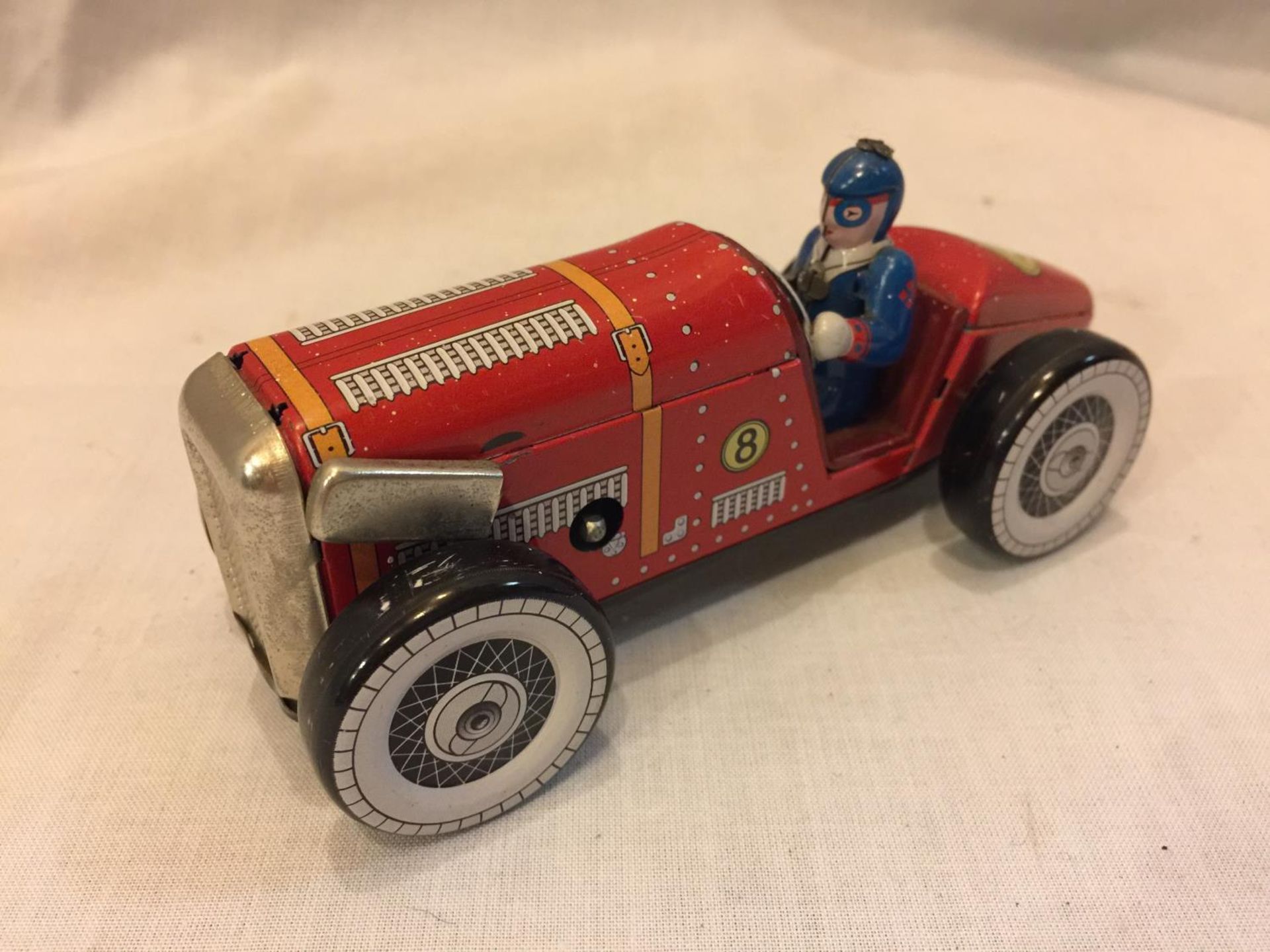 A TIN PLATE TOY CAR