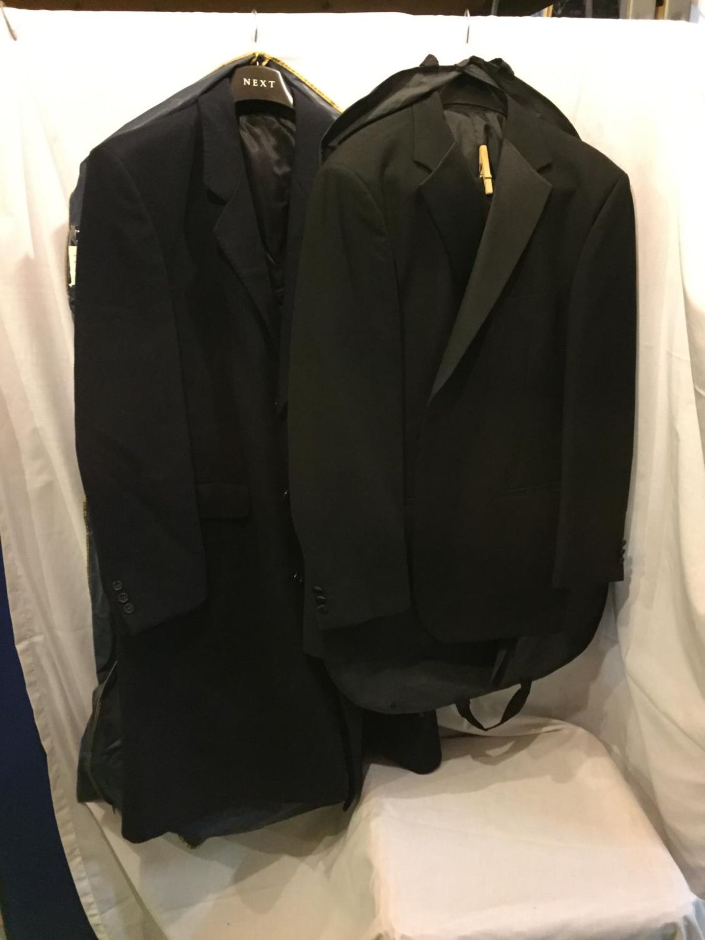 A BLACK MARKS AND SPENCERS SUIT AND A CROMBIE COAT