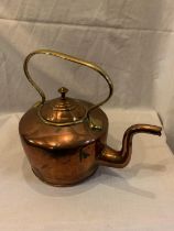 A VINTAGE COPPER AND BRASS KETTLE