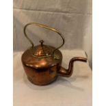 A VINTAGE COPPER AND BRASS KETTLE