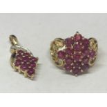 A 9 CARAT GOLD RING MARKED 375 WITH FIFTEEN PINK COLOURED STONES IN A CLUSTER DESIGN AND