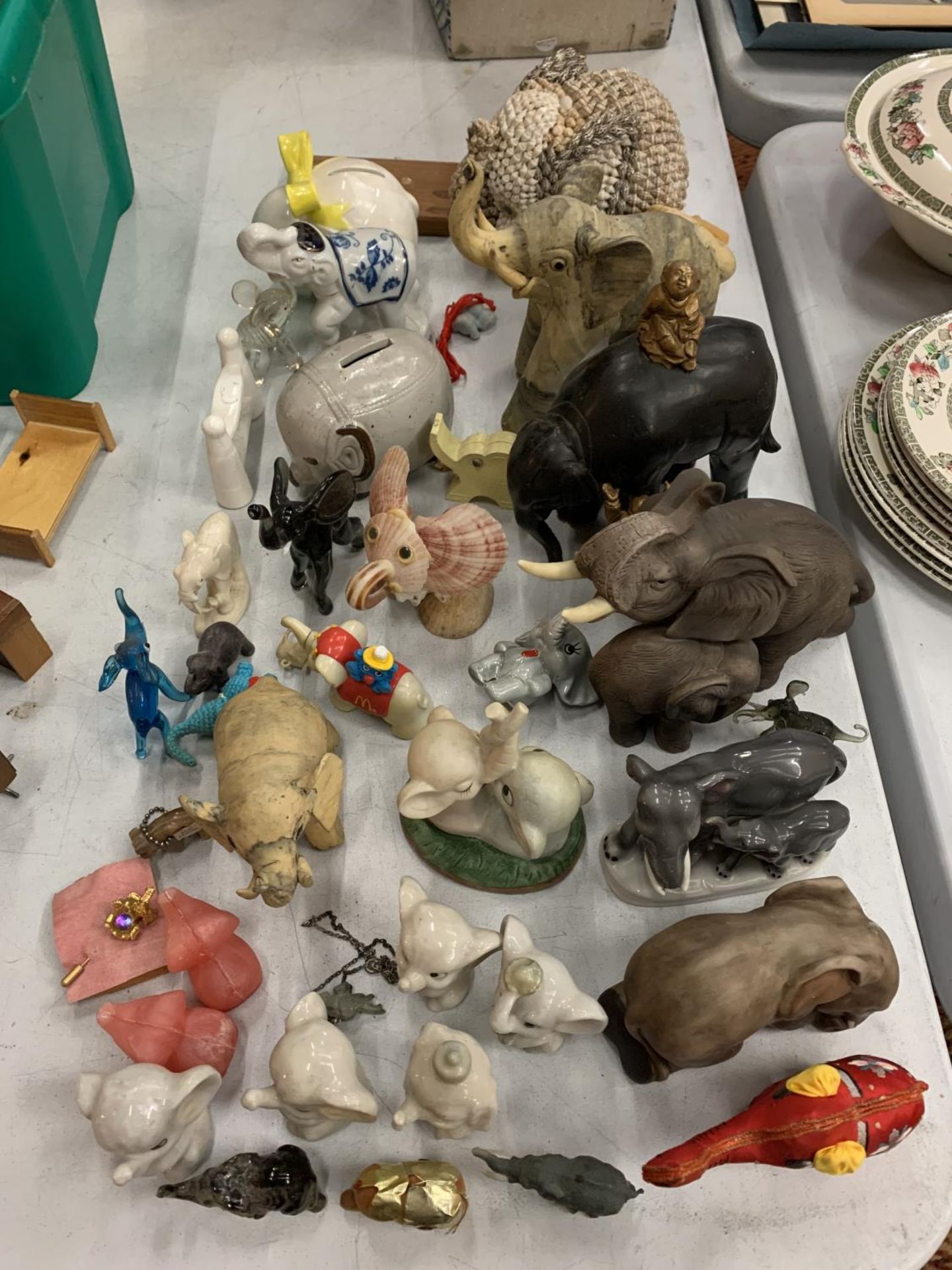 A LARGE QUANTITY OF COLLECTABLE ELEPHANTS OF ALL SIZES, INCLUDES, CERAMIC, WOODEN, ETC