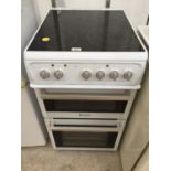 A WHITE HOTPOINT FREESTANDING ELECTIRC OVEN AND HOB