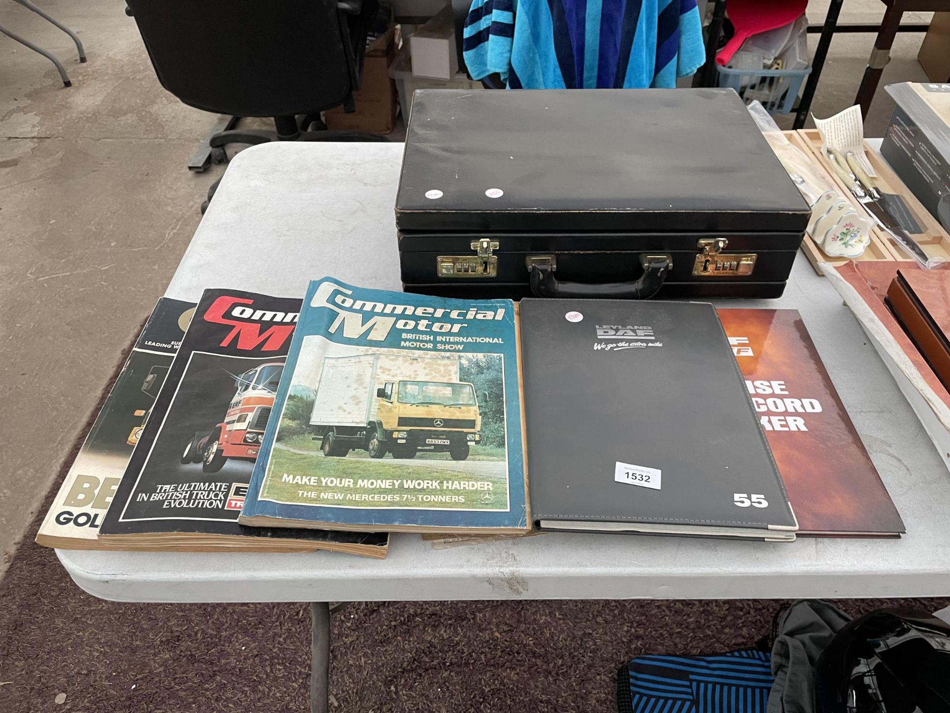 A LOCKABLE BRIEFCASE AND VARIOUS CAR MANUALS