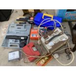 AN ASSORTMENT OF TOOLS TO INCLUDE A SHOPRIDER CHARGER, A FOOT PUMP AND SANDING BLOCKS ETC