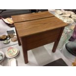 A WOODEN SEWING STOOL/BOX WITH HALF HINGED LID