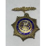 A SILVER GILT MASONIC MEDAL 1977