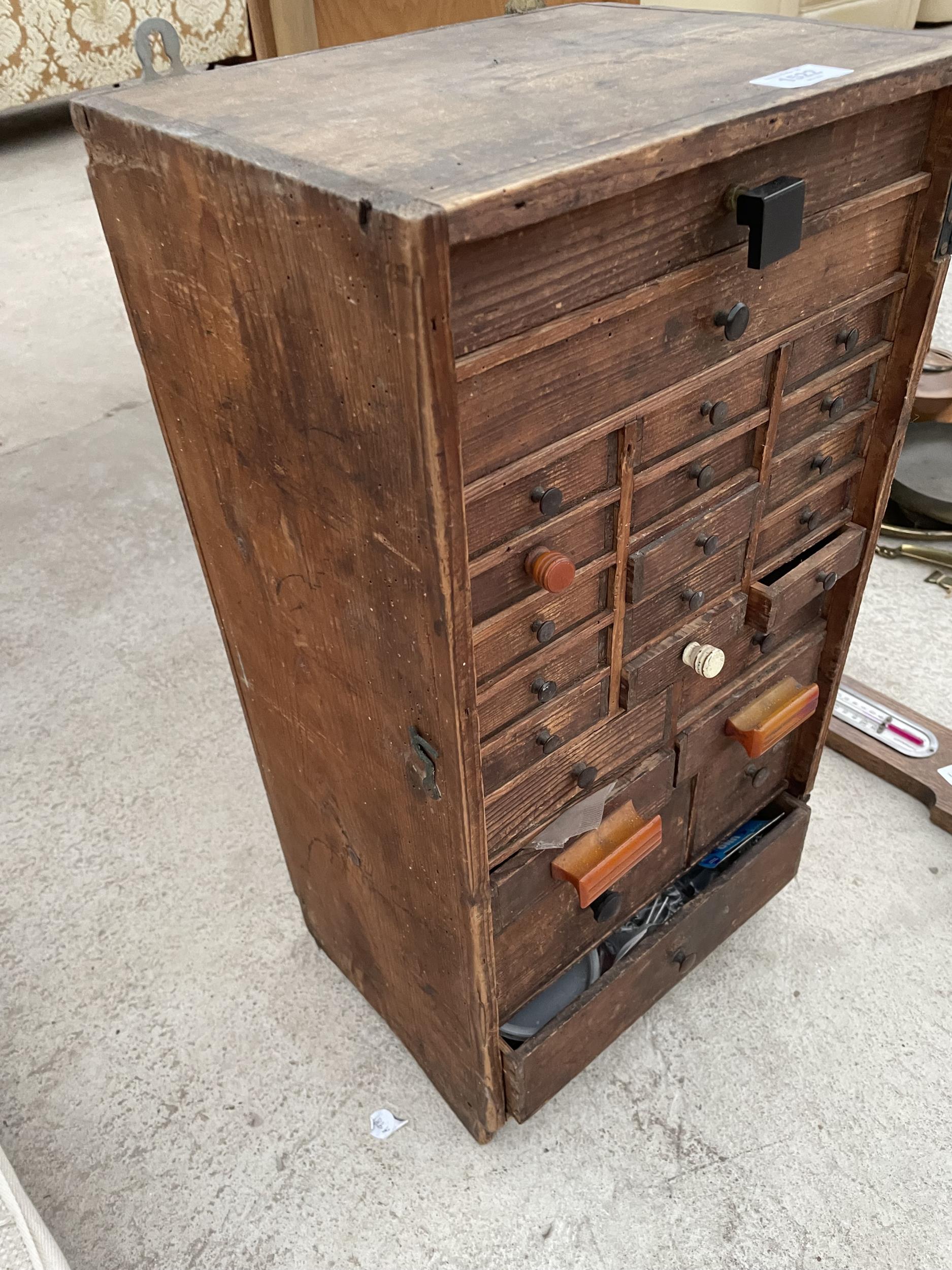 A VINTAGE VICTORIAN PINE WATCHMAKERS HABERDASHERY CABINET, ENCLOSING 24 VARIOUS SIZED DRAWERS AND TO - Image 3 of 4