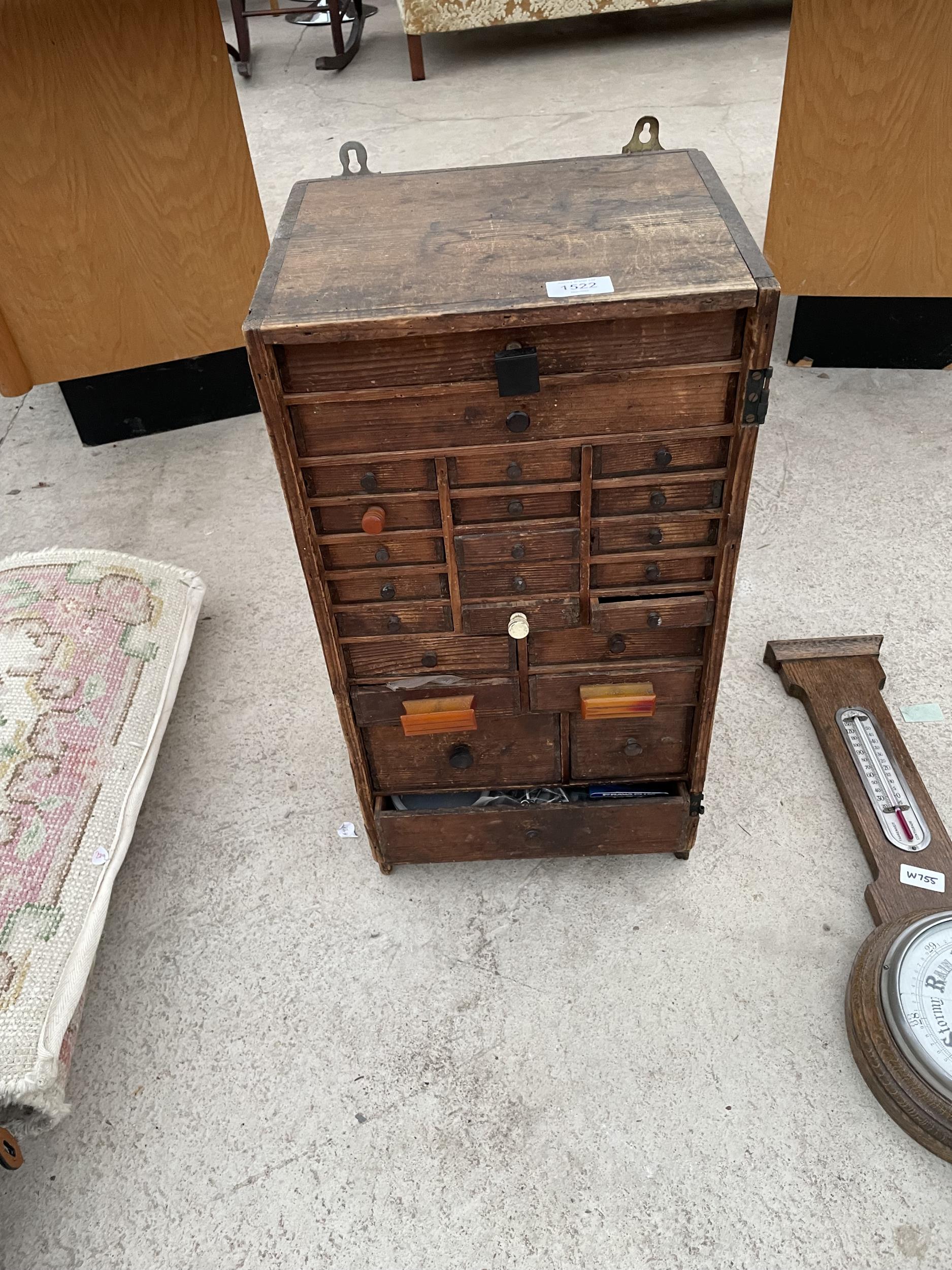 A VINTAGE VICTORIAN PINE WATCHMAKERS HABERDASHERY CABINET, ENCLOSING 24 VARIOUS SIZED DRAWERS AND TO