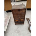 A VINTAGE VICTORIAN PINE WATCHMAKERS HABERDASHERY CABINET, ENCLOSING 24 VARIOUS SIZED DRAWERS AND TO