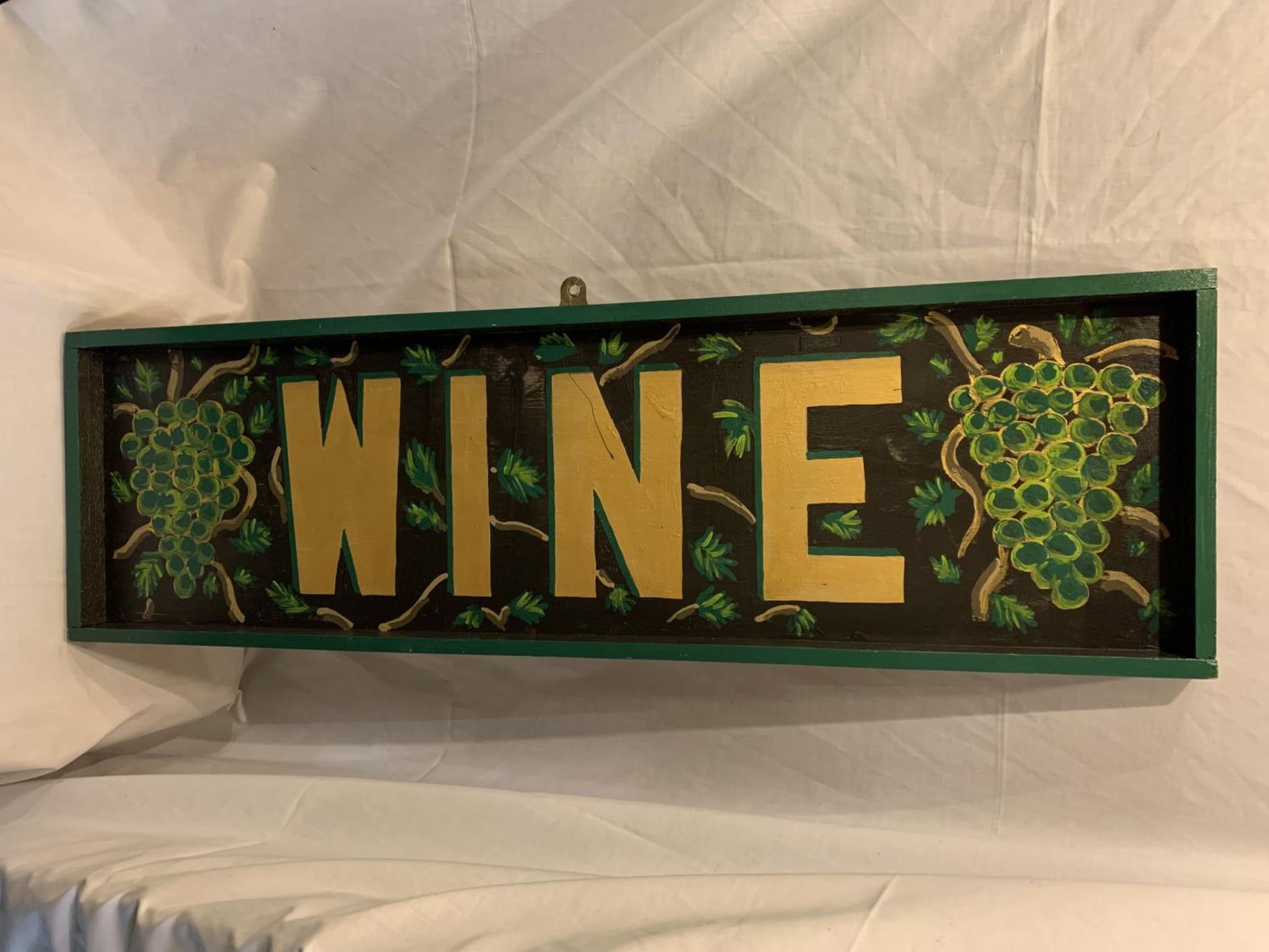 A WOODEN HAND PAINTED WINE SIGN 102CM X 30CM